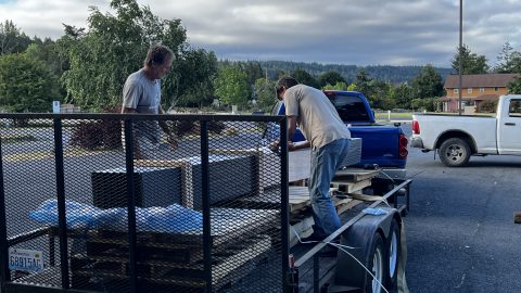Rob Manly & Andrew Fowler unload metal roofing